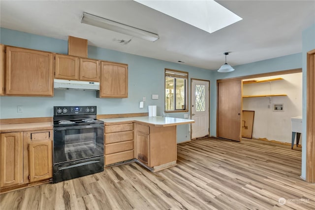 kitchen featuring pendant lighting, a skylight, electric range, kitchen peninsula, and light brown cabinets