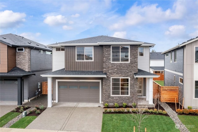 view of front of home with a garage and a front yard