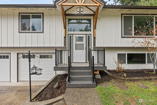 view of exterior entry with a garage