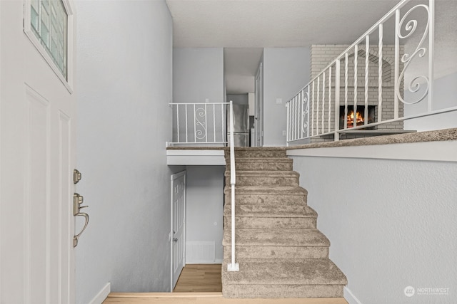 staircase with hardwood / wood-style flooring