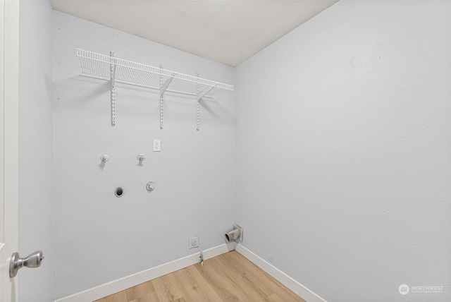 laundry area with hardwood / wood-style flooring and gas dryer hookup