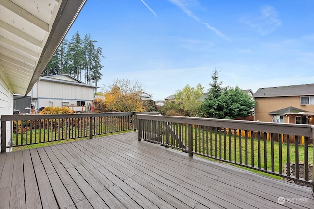 wooden deck with a yard