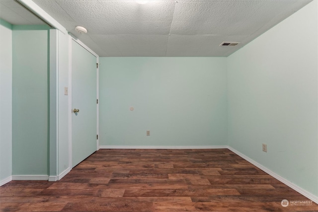 310 W 3rd Ave, Ritzville, WA 99169 - unfurnished room featuring a smoke detector, wood finished floors, baseboards, and a textured ceiling