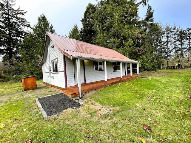 2820 State Route 105, Grayland, WA 98547 - view of front of home featuring a front yard, metal roof, and covered porch