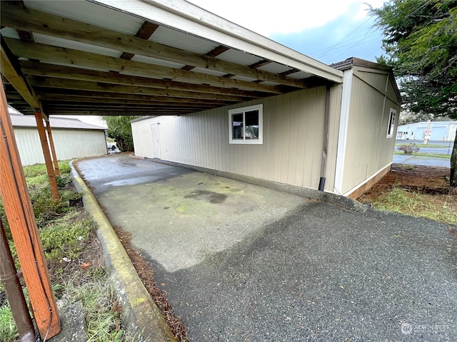 view of car parking with a carport