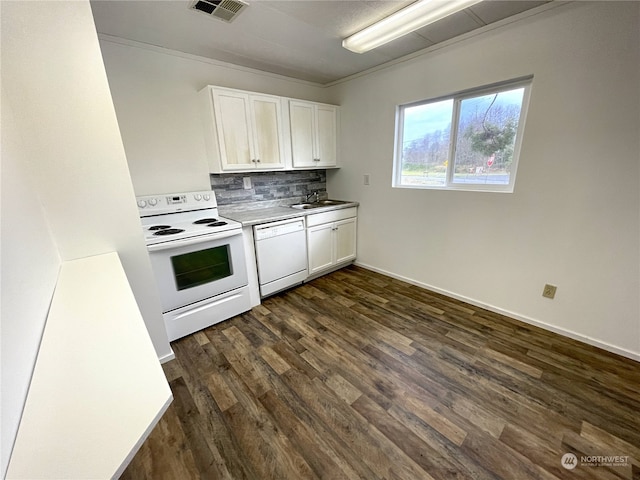 kitchen with white appliances, visible vents, white cabinets, dark wood-type flooring, and backsplash