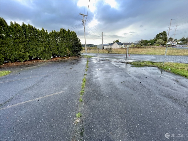 view of street featuring a gate