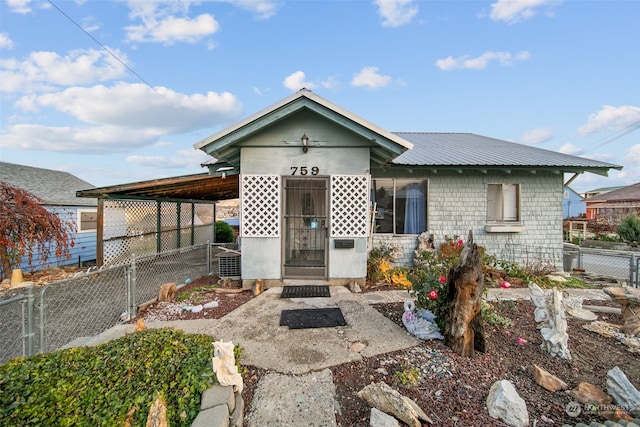 view of front of house with a carport