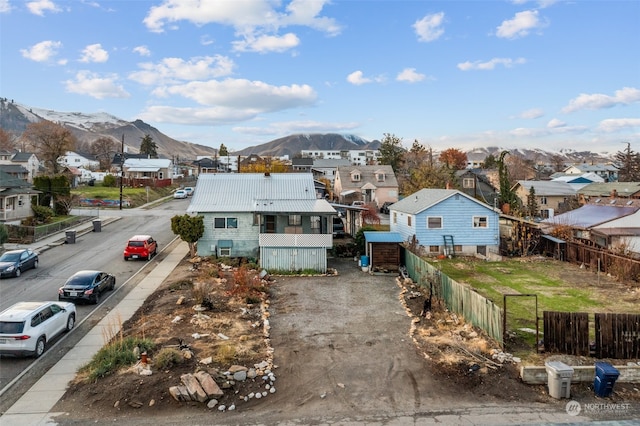 birds eye view of property featuring a mountain view