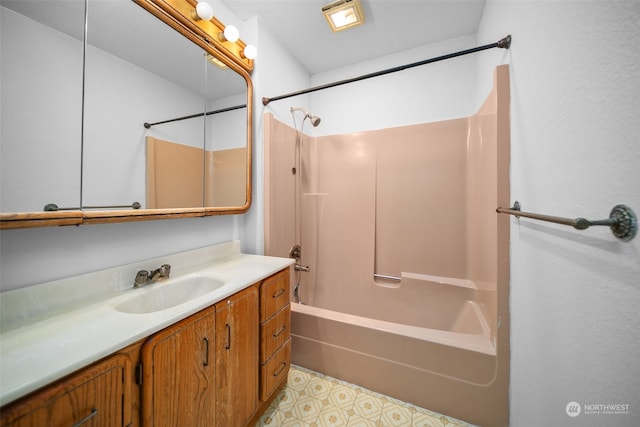 bathroom with bathing tub / shower combination and vanity