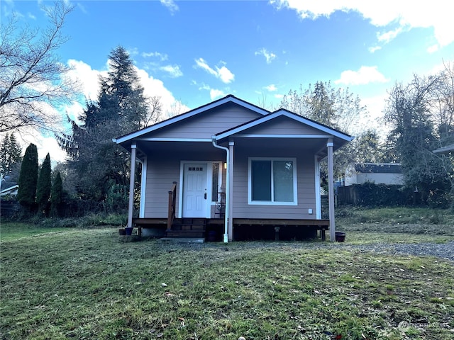 view of front of home with a front lawn and a porch