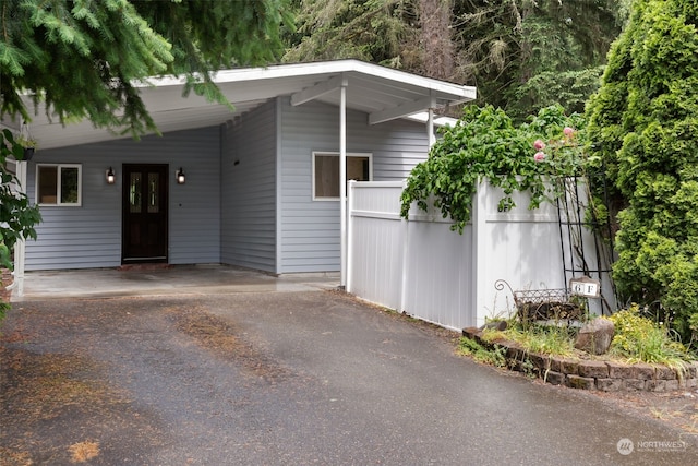 view of front facade with a carport