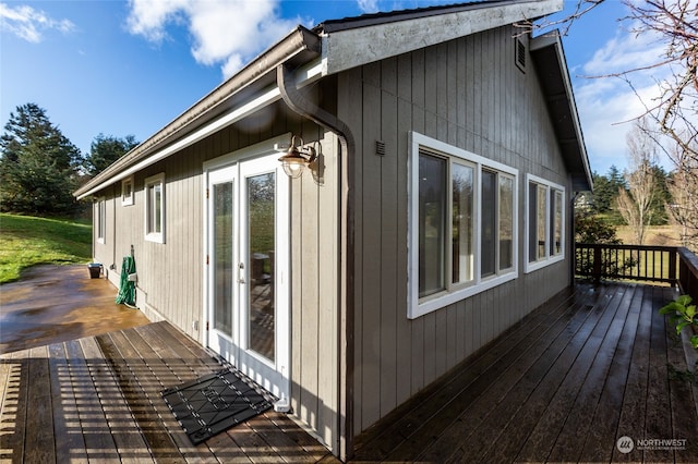 view of property exterior featuring a wooden deck