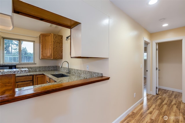 kitchen featuring light hardwood / wood-style floors and sink