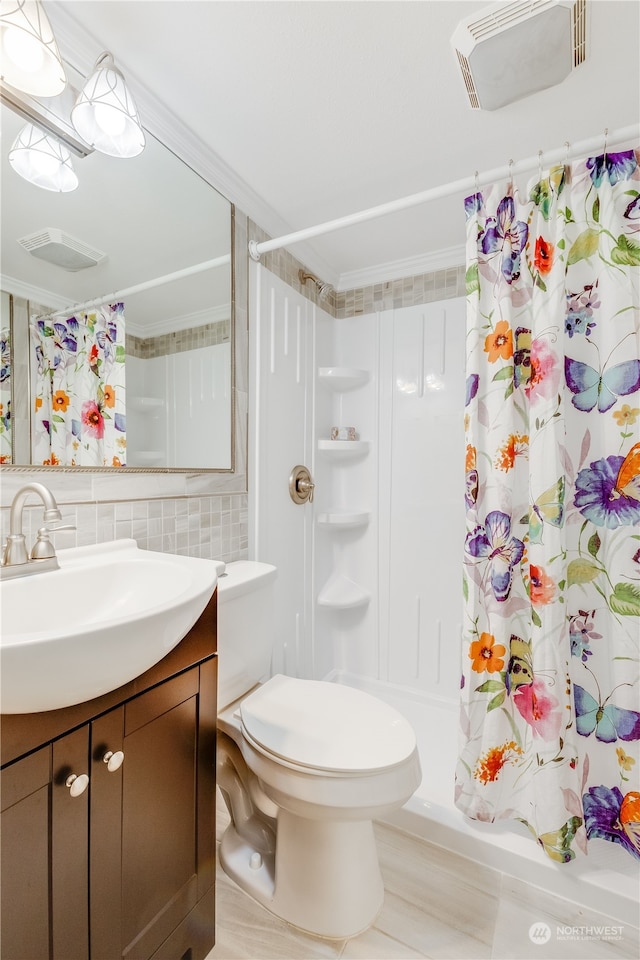 bathroom with a shower with curtain, vanity, tile walls, and toilet