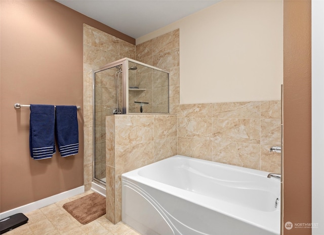 bathroom with tile patterned flooring and shower with separate bathtub