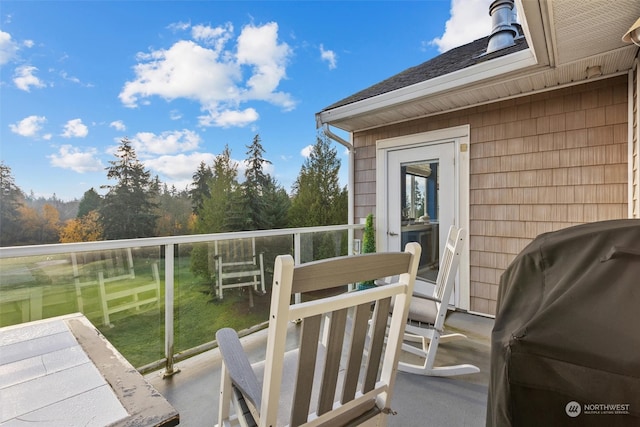 view of patio featuring a balcony and grilling area