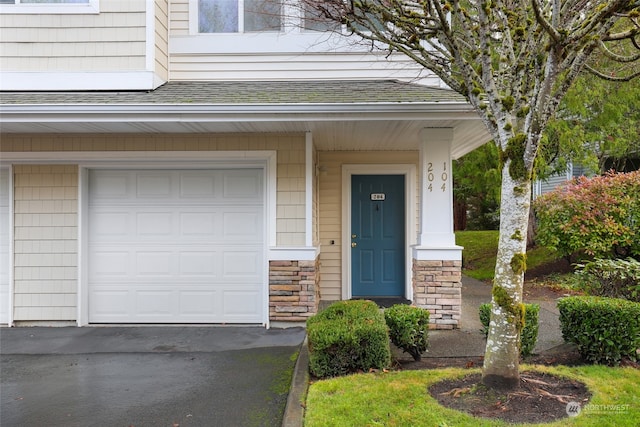 entrance to property featuring a garage