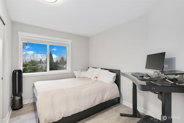 bedroom featuring light hardwood / wood-style floors