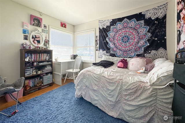 bedroom featuring hardwood / wood-style floors