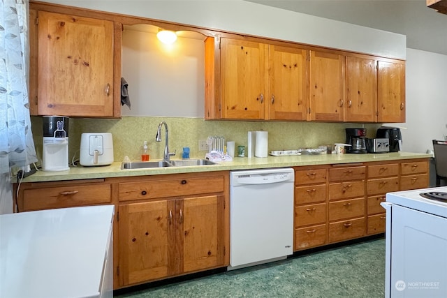 kitchen featuring decorative backsplash, white appliances, and sink