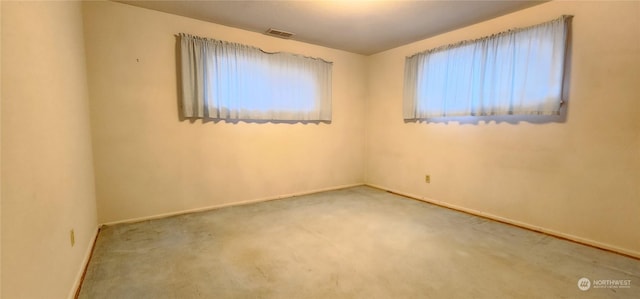 spare room featuring carpet