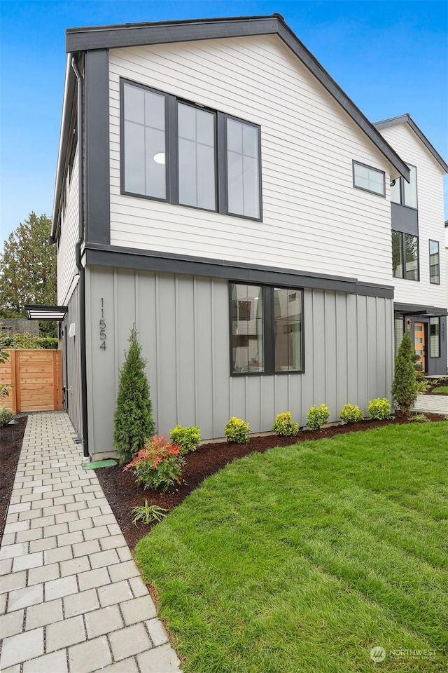 view of home's exterior featuring a yard