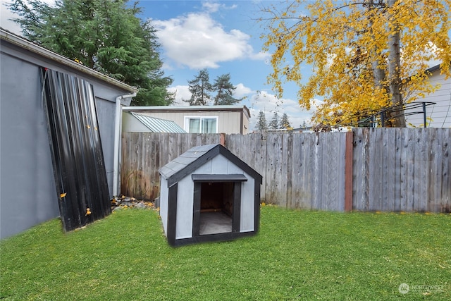 view of outbuilding with a yard