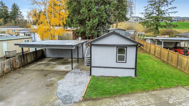 view of outbuilding featuring a carport