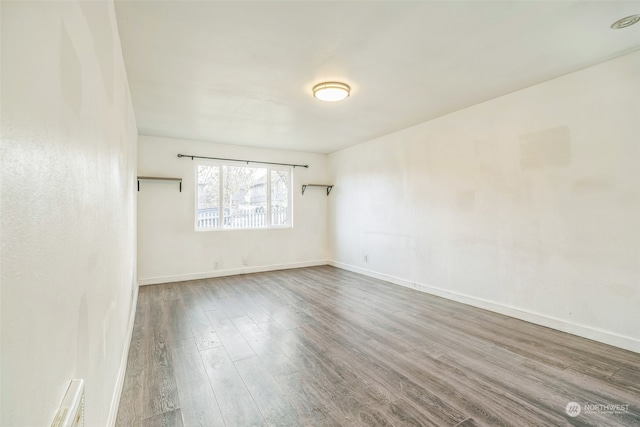 spare room featuring hardwood / wood-style flooring