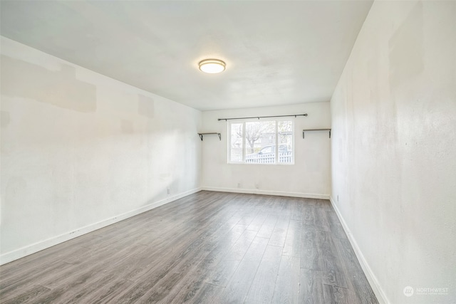 unfurnished room featuring hardwood / wood-style floors