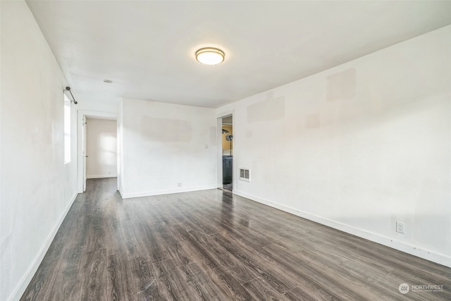 unfurnished room featuring dark hardwood / wood-style floors