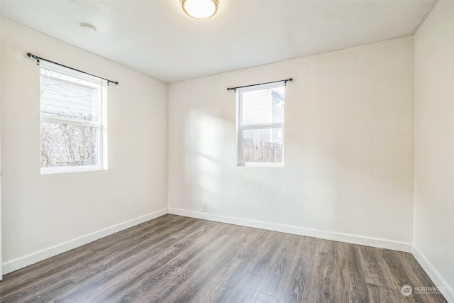 empty room featuring hardwood / wood-style floors and a healthy amount of sunlight