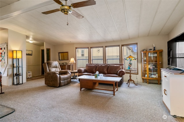 carpeted living room with vaulted ceiling and ceiling fan