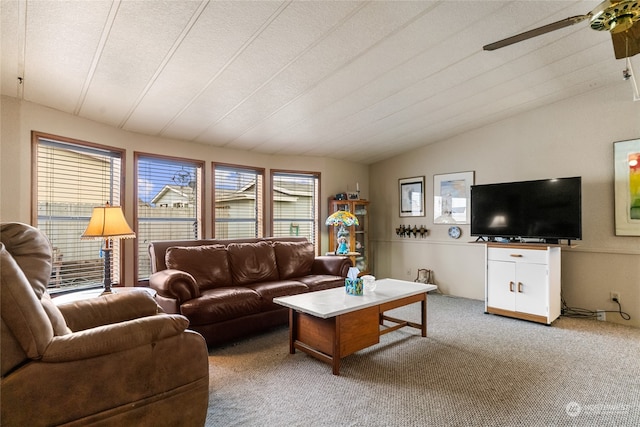 living room with carpet, ceiling fan, lofted ceiling, and a textured ceiling