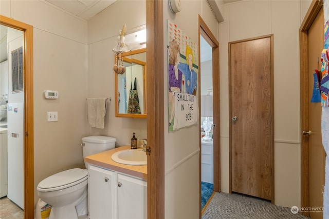 bathroom with vanity and toilet