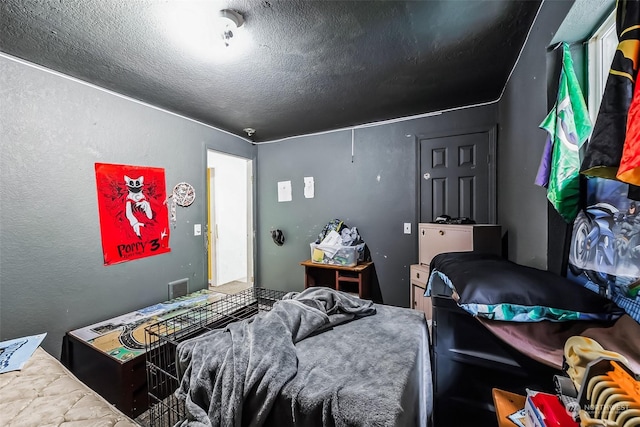 bedroom featuring a textured ceiling