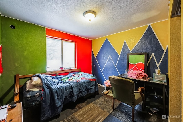 bedroom featuring a textured ceiling