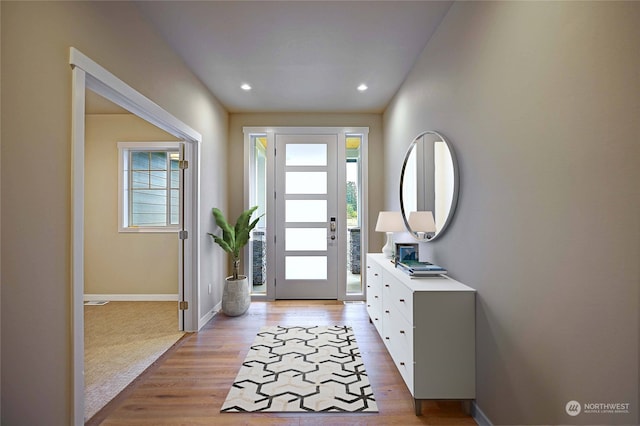 entryway with light hardwood / wood-style flooring