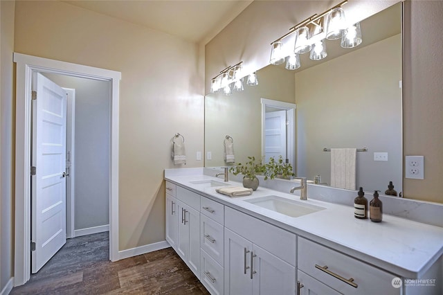 bathroom with vanity and wood-type flooring