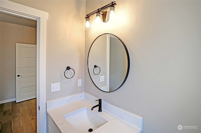 bathroom featuring hardwood / wood-style flooring and vanity