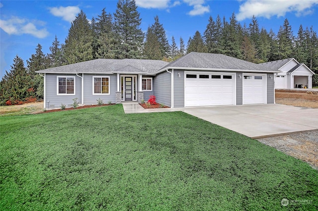 single story home with a garage and a front lawn