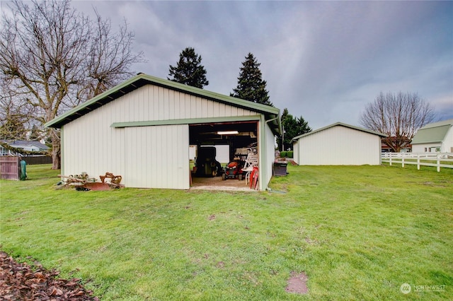 view of outbuilding with a yard