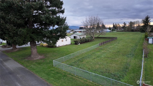 view of yard at dusk