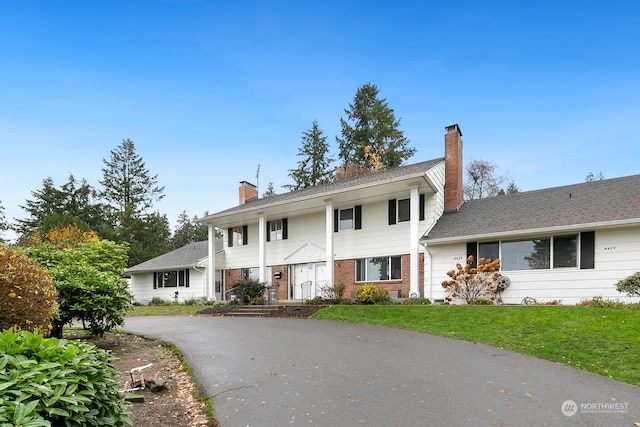 view of front of home with a front lawn