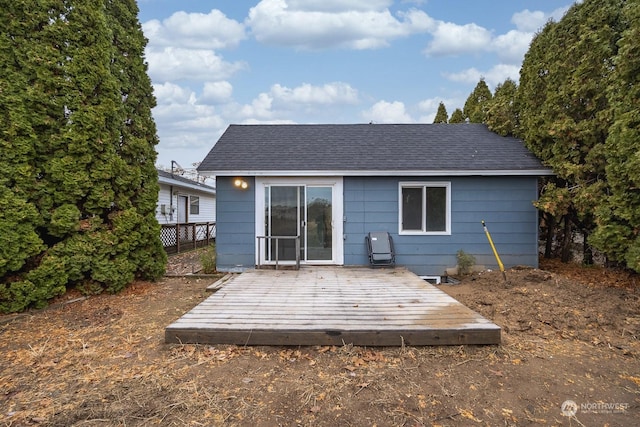 back of house with a wooden deck