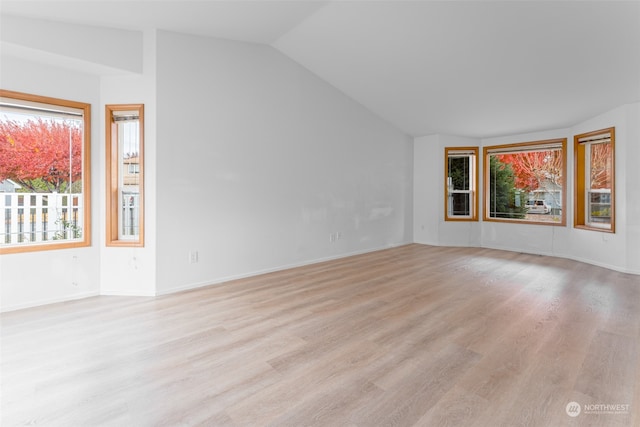 interior space featuring light hardwood / wood-style flooring and lofted ceiling