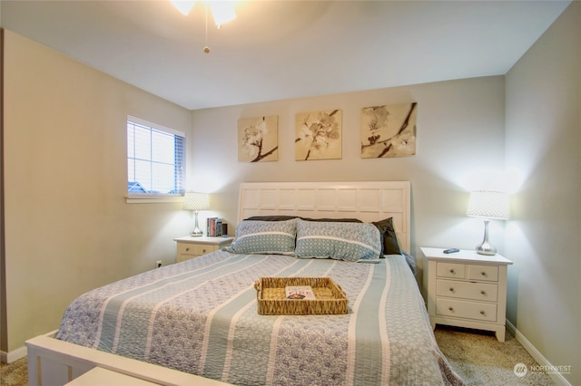 bedroom featuring light carpet