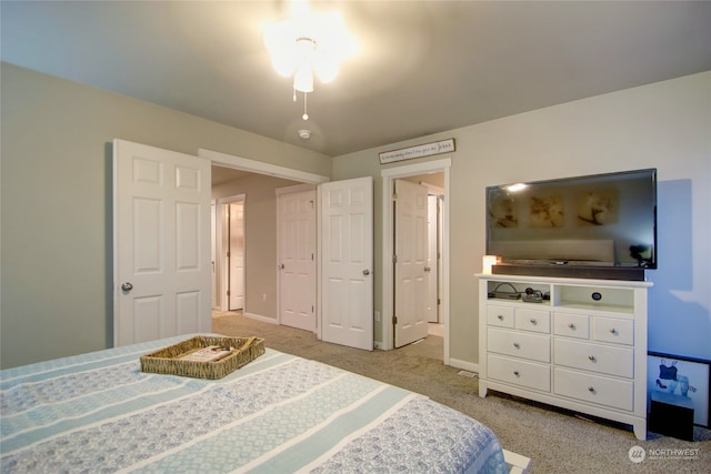 bedroom featuring light carpet