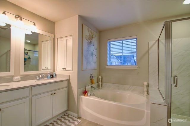 bathroom with separate shower and tub and vanity